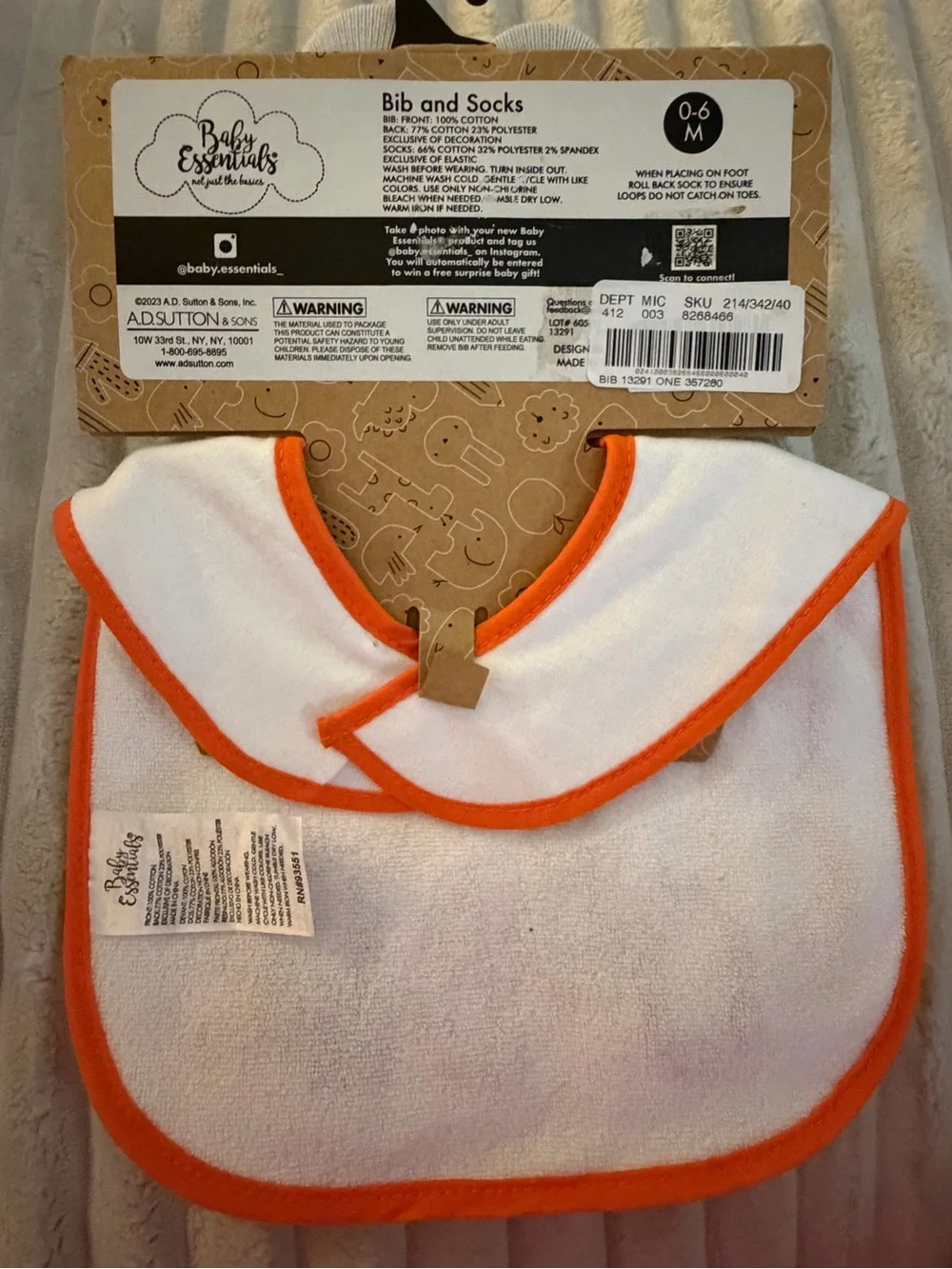 Baby Essentials Baby Bib with Orange Trim